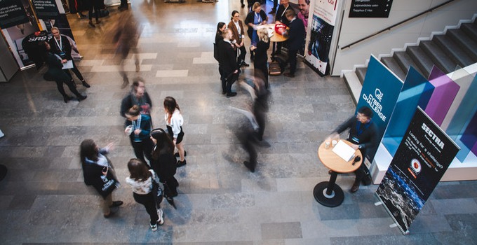 People talking to each other in the entrance hall at the SEDU.